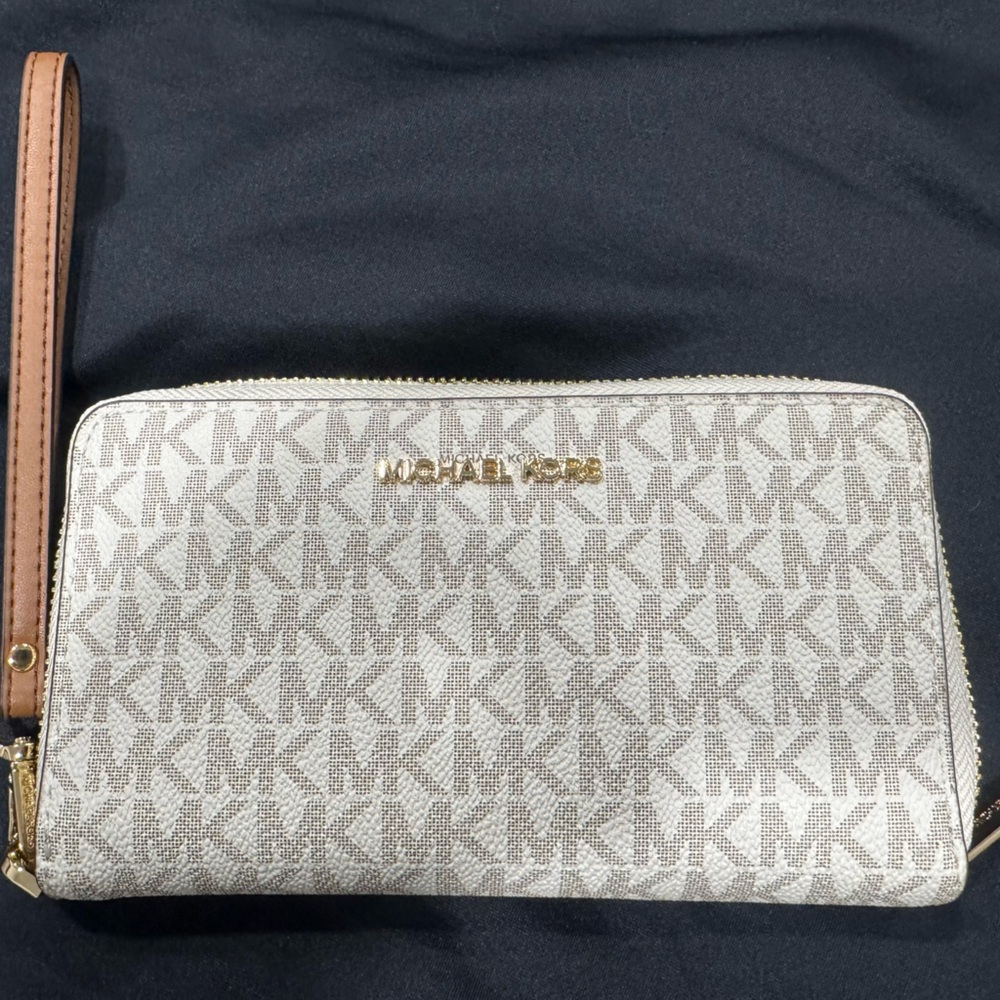 Wrist wallet with cell phone compartment